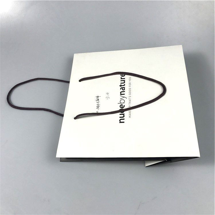 COMESTIC SHOPPING PAPER BAG WITH BRAND logo